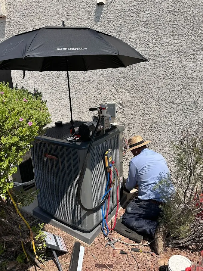 HVAC technician performing outdoor AC maintenance in Morris Plains